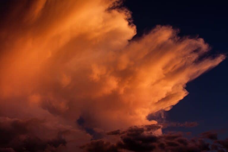 Dramatic orange clouds at sunset sky.